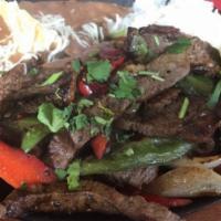 Steak Fajitas · With sautéed onion and bell peppers