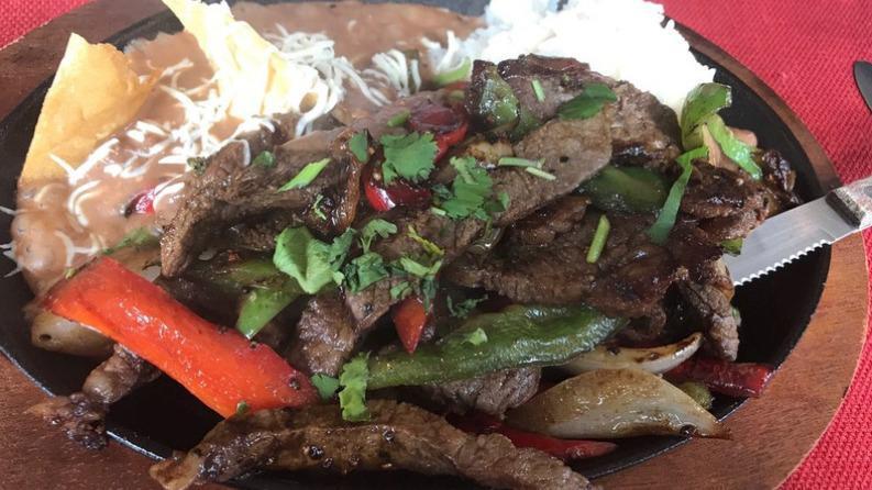 Steak Fajitas · With sautéed onion and bell peppers