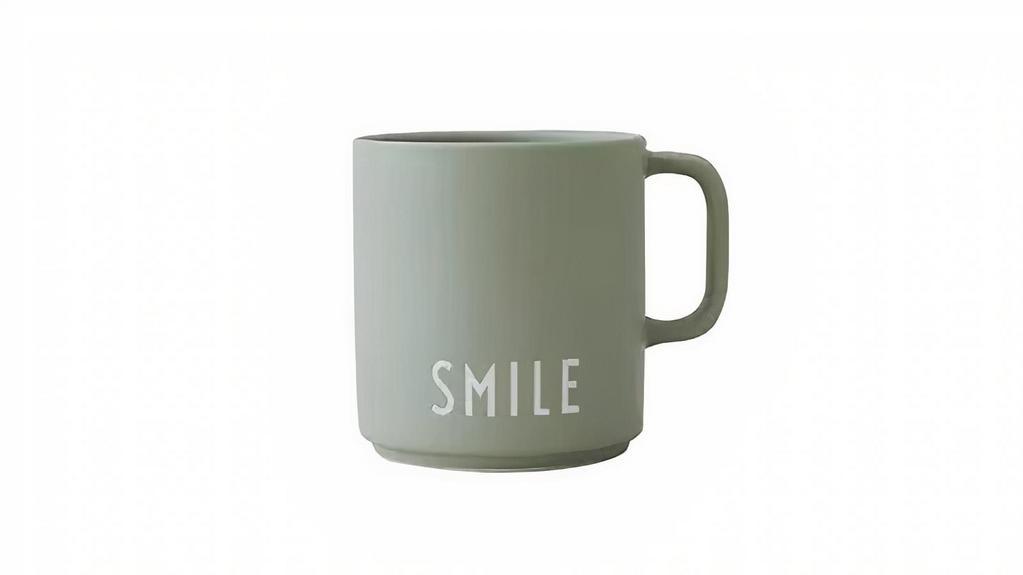 Favorite Cup With Handle - Smile · The popular favorite cup with handle. The handle is not just stylish it is also comfortable to hold. The cup is designed in the finest ultra-matt glazed porcelain with laser engraved letters. A safe gift hit for birthdays, Christmas, graduation, weddings, the grandparents-to-be, and housewarming. Personal porcelain cup in fine bone china. Use it for warm or cold drinks, pencils, flowers, your toothbrush, and many other things.