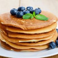 Blueberry Pancakes With Eggs · Delicious, hot buttermilk pancakes cooked to perfection, and topped with fresh blueberries. ...