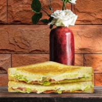 Fancy Grilled Cheese · Melted cheddar and mozzarella cheese with caramelized onions, tomato, and ripe avocado, betw...