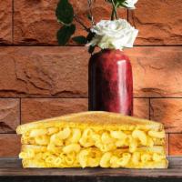Mac Cheesy Grilled Cheese · Creamy classic mac and cheese with crispy bacon on two slices of buttery grilled bread.