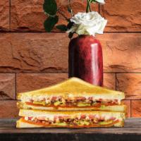 Veggie Stop Grilled Cheese · Melted cheddar cheese, ripe avocado, tomato, grilled onions, roasted red peppers, and mayo b...