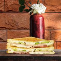 Turkey Turnover Grilled Cheese · Melted jack and havarti cheese, roasted sliced turkey, and cranberry sauce, between two slic...