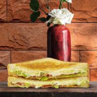 Bacon Club Grilled Cheese · Melted cheddar, bacon, and avocado between two slices of buttery grilled bread.