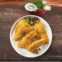 Golden Tenders · Chicken tenders are breaded and fried until golden brown.