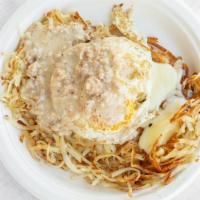 Breakfast Poutine · Hashbrowns topped with cheese curds sausage patty over easy egg and sausage gravy.