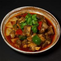 Braised Lamb Shoulder 黄焖羊肉 · Fork tender lamb loin chops, onion, and peppers.