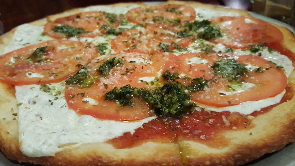 Margherita Pizza · Our classic crust with mozzarella, fresh mozzarella, pizza sauce, fresh basil, olive oil, and grated parmesan cheese.