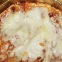 Baked Ziti Parmigiana · Ziti pasta with our famous marinara sauce, Parmesan cheese baked with mozzarella (side of It...