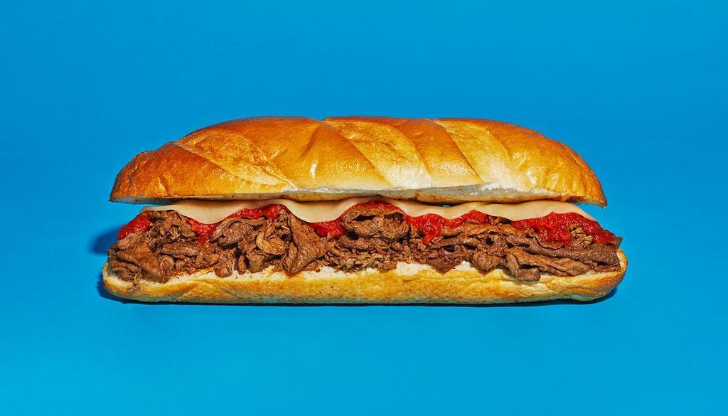 Pizza Cheesesteak · Sliced steak with melted provolone and mozzarella, and marinara on a hoagie roll.