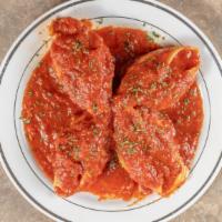 Baked Stuffed Shells · Shell shaped pasta with a filling.