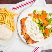 Grilled Salmon With Mushroom Sauce · Rice, sauteed vegetables and French fries.