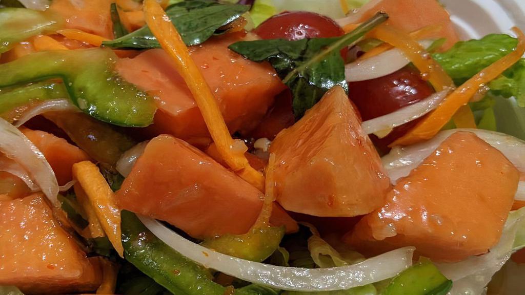 Fruit Papaya Salad · Low-calorie salad with yummy green papaya, tomatoes, carrots, string bean and crushed peanut in lime juice dressing. Hot and spicy.