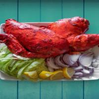 Tandoori Chicken · whole or half chicken marinated in yogurt mixed with our famous spices