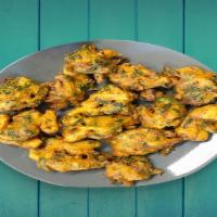 Mixed Pakora · mix of flavorful deep fried crispy fitters made with mix vegetables, gram flour and Indian s...