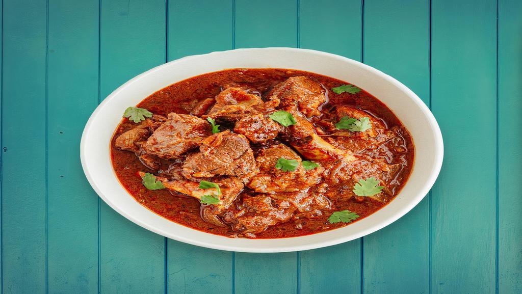 Lamb Vindaloo · spicy tender lamb made with coconut, vinegar and lots of hot red chilli peppers