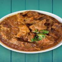 Lamb Rogenjosh · finely cut pieces of lamb in a gravy made of yogurt, garlic, ginger, onions and house blend ...