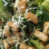Caesar Salad · Chopped romaine lettuce, parmesan cheese, caesar dressing tossed, and topped with croutons.