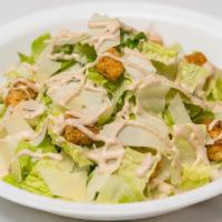 Caesar Salad · Romaine lettuce, parmigiano cheese, croutons, with our home-made Caesar dressing.