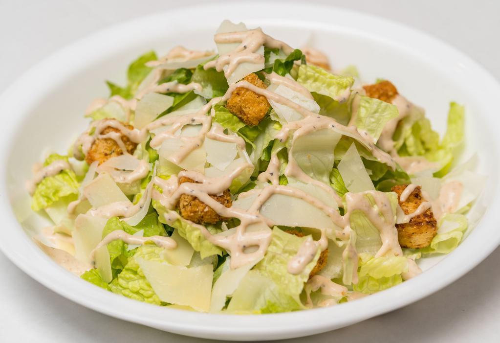 Caesar Salad · Romaine lettuce, parmigiano cheese, croutons, with our home-made Caesar dressing.