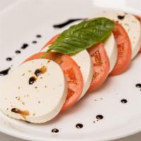 Caprese Salad · Vine ripened tomatoes, fresh mozzarella.