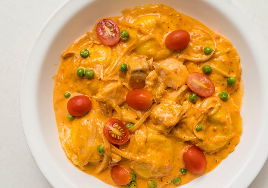 Lobster Ravioli Special · Lobster ravioli sauteed with fresh salmon, shallots, cherry tomatoes, green peas and a light vodka sauce.