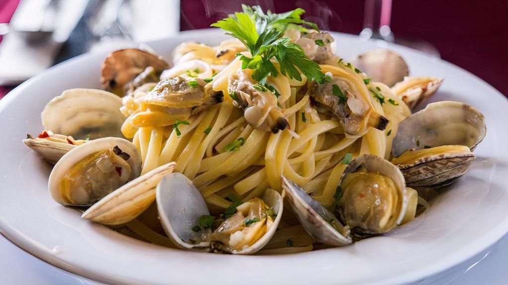Linguini With Clam Sauce · Fresh baby clams sauteed in garlic & oil, hint of wine 