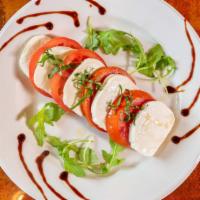 Caprese Platter · Sliced tomatoes, fresh mozzarella and basil.