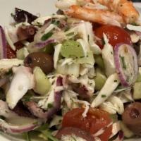 Wild Seafood Salad · lump crab meat, shrimp, sea scallops, sliced octopus, cherry tomatoes, kalamata olives, red ...