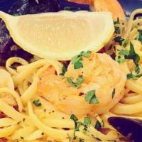 Seafood Pasta · Linguine with shrimp, scallops, clams, and mussels served in a rich, house-made tomato and f...