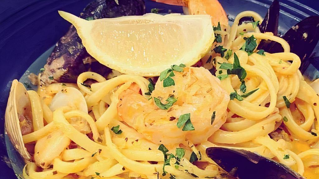 Seafood Pasta · Linguine with shrimp, scallops, clams, and mussels served in a rich, house-made tomato and fennel cream sauce.