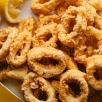 Fried Calamari Plate · A fried calamari steak served pupu style, seasoned with our special Karai seasoning, and ser...