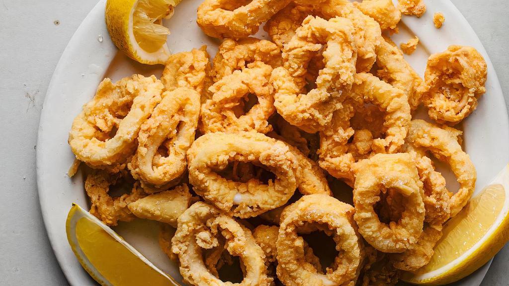 Fried Calamari Plate · A fried calamari steak served pupu style, seasoned with our special Karai seasoning, and served with your choice of 2 sides.