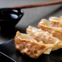 Pan-Fried Dumplings / 煎饺 · Cooked in oil in a pan stuffed dough.