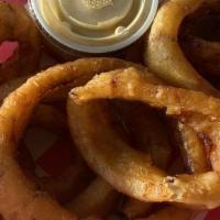Black & Tan Onion Rings · Premium beer-battered onion rings deep fried and served with a side of house-made chipotle d...