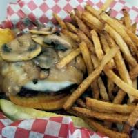 Mushroom Swiss Burger · Topped with fresh mushrooms sautéed in garlic butter and thick slices of aged Swiss.