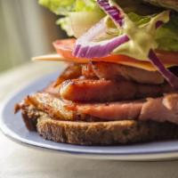 Italian Hero Sandwich · Hot Hero sandwich made with Ham, salami, provolone cheese, lettuce, tomato, and mayo.