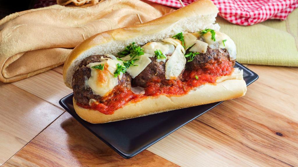 Meatball Parmigiana Hero Sandwich · Hot Hero sandwich made with Meatballs, Parmesan cheese, and marinara sauce.