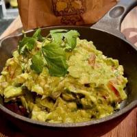 Guacamole · Avocado, Cilantro, Tomato, Onion, Serrano Pepper, Lime Juice, Served With Homemade Tortilla ...