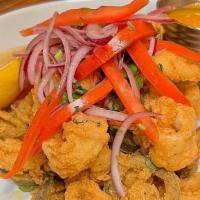 Fried Calamari · Fried Calamari, Fried Pickled Jalapeno, Garnished With Onions And Cilantro, Served With Home...