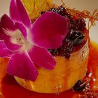 Flan · Homemade Caramel Custard, Orange Zest, Topped With Mixed Berries And Dehydrated Orange Slice