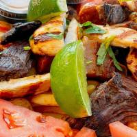 Picada Colombiana (Serves 2-3) · skirt steak, grilled chicken. pork chicharron, Colombian chorizo, morcilla ( blood sausage),...