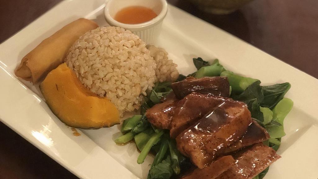 Black Pepper Seitan · Tender, thinly sliced medallions of wheat protein, sautéed in a savory black pepper, and brown sauce over a bed of Chinese broccoli. Served with brown rice.