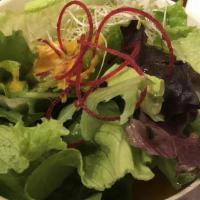 Green Salad · Mixed greens with beets and alfalfa sprouts with carrot ginger dressing.