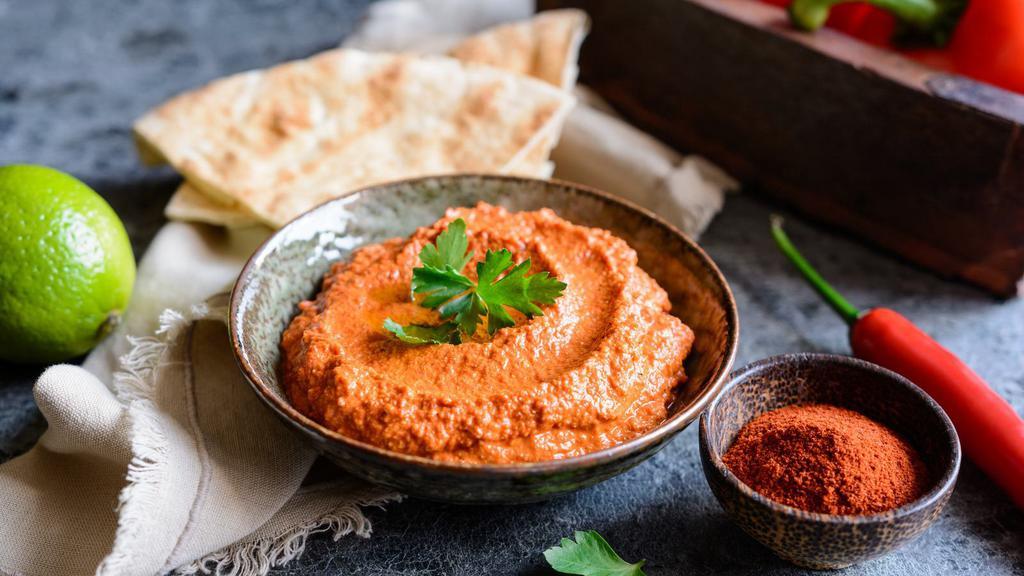 Mouhamara · Delicious Mediterranean dip prepared with Sun-dried Red Peppers, Walnuts, Pomegranate Molasses, Olive Oil & a blend of spices.