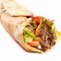 Beef Shawarma Wrap · Thin juicy beef with lettuce, tomato, onions and tzatziki sauce, served on pita bread.