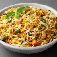 Biryani Style Rice Bowl · Fresh vegetables and rice tossed with house spices and garlic-cilantro sauce.