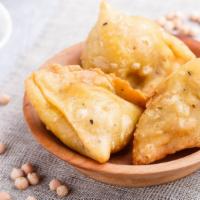 Samosas · Enjoyable Indian puff pastries full of satisfying potatoes and peas.