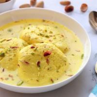 Rasmalai · Delectable Indian dessert made from cheese, milk, and almonds.